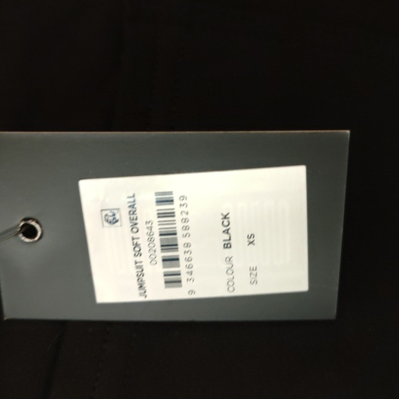 Black soft jumpsuit with back and side pockets; elastic leg bottoms - Picture 5 of 10